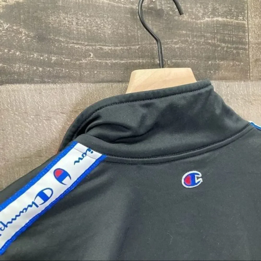 The Champion Tape Trim Mockneck Track Jacket in Black
